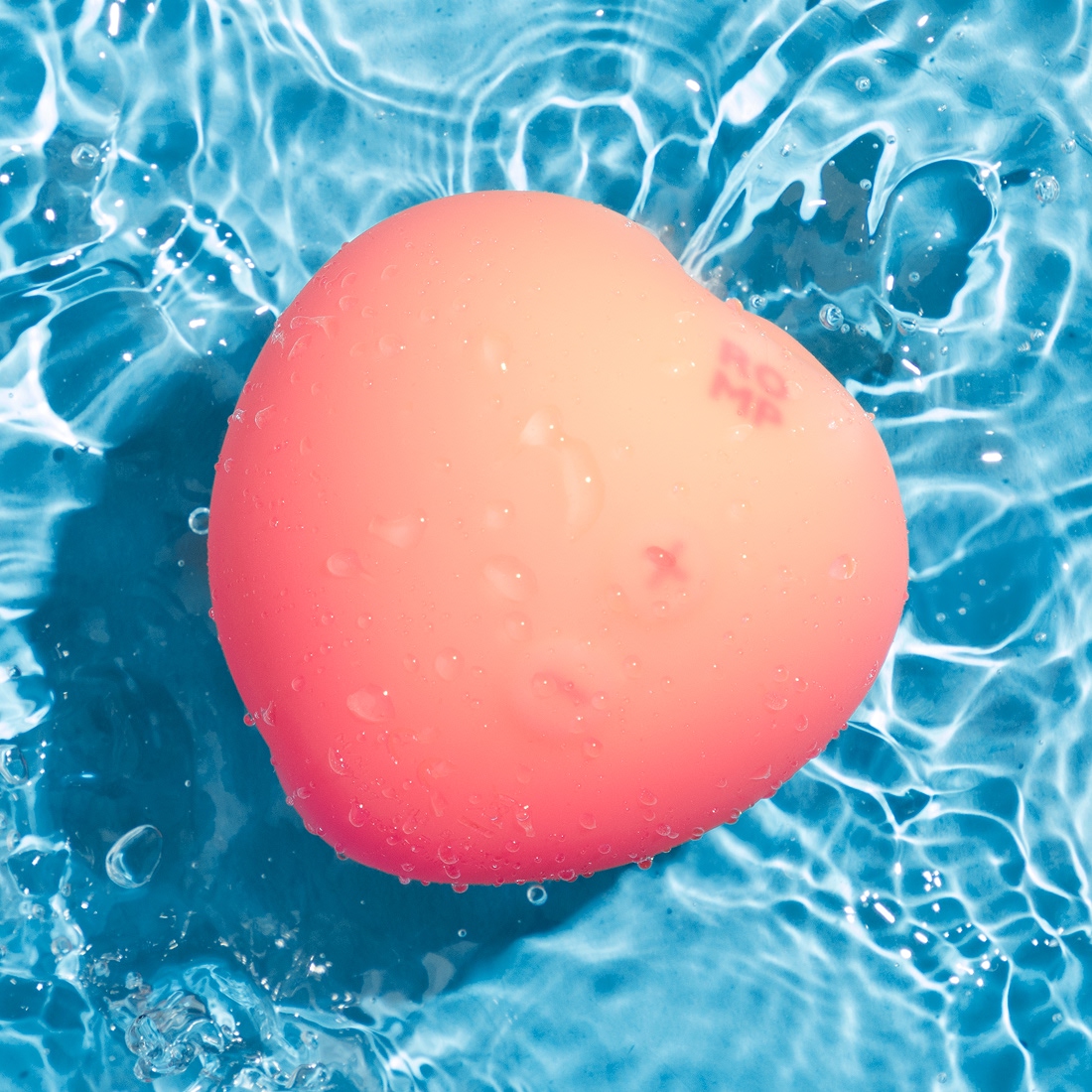 Romp by Womanizer Pink Peach bezdotykowy masażer łechtaczki